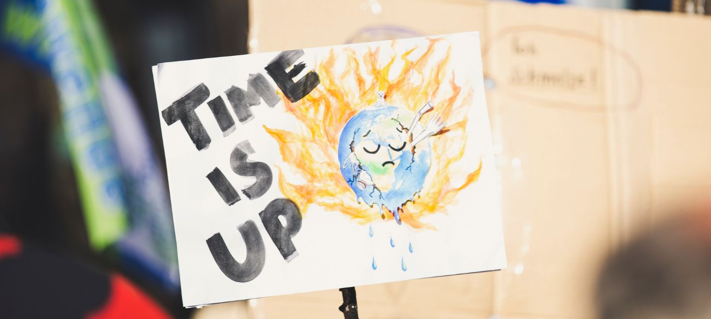 Picture of a sign saying "time is up", refering to global warming.
