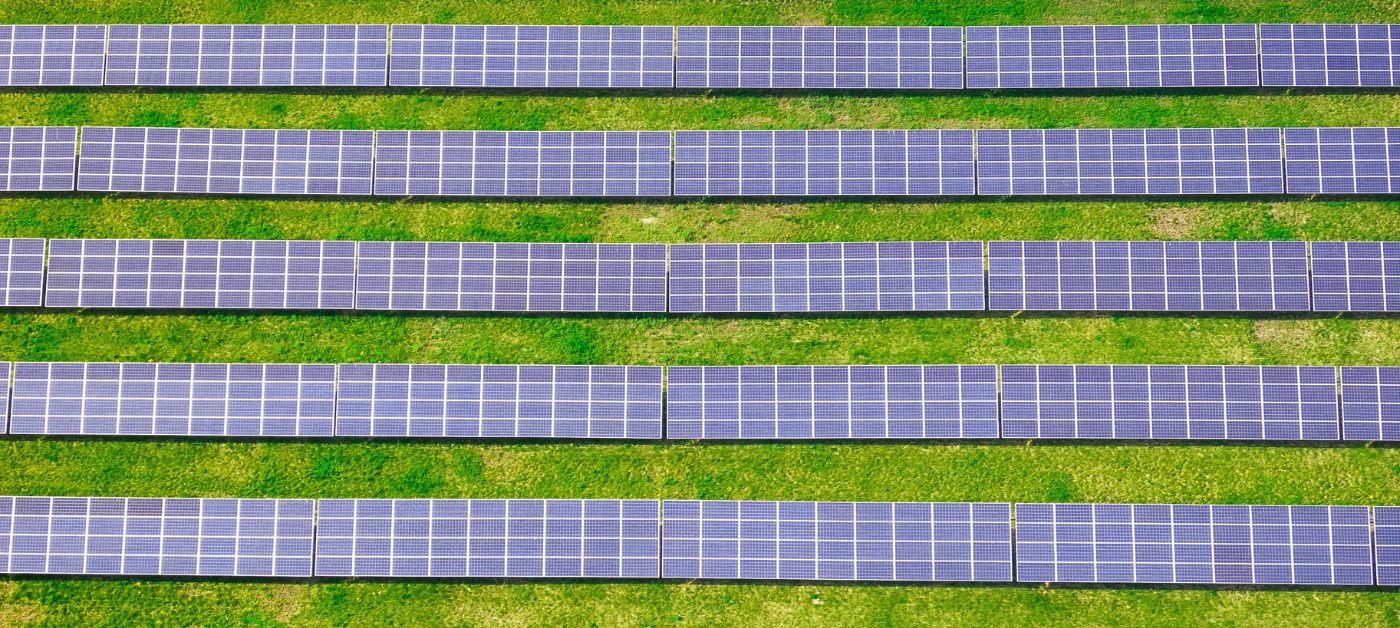 Photo of solar panels, they are an example of the meaning of offsetting emissions.